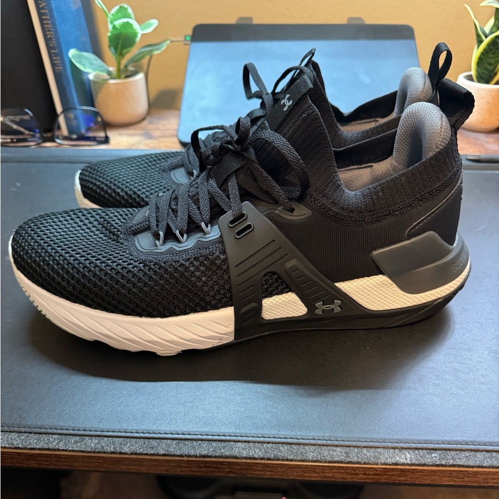 Under Armour Project Rock 4. Size 12. Black/White. Preowned.